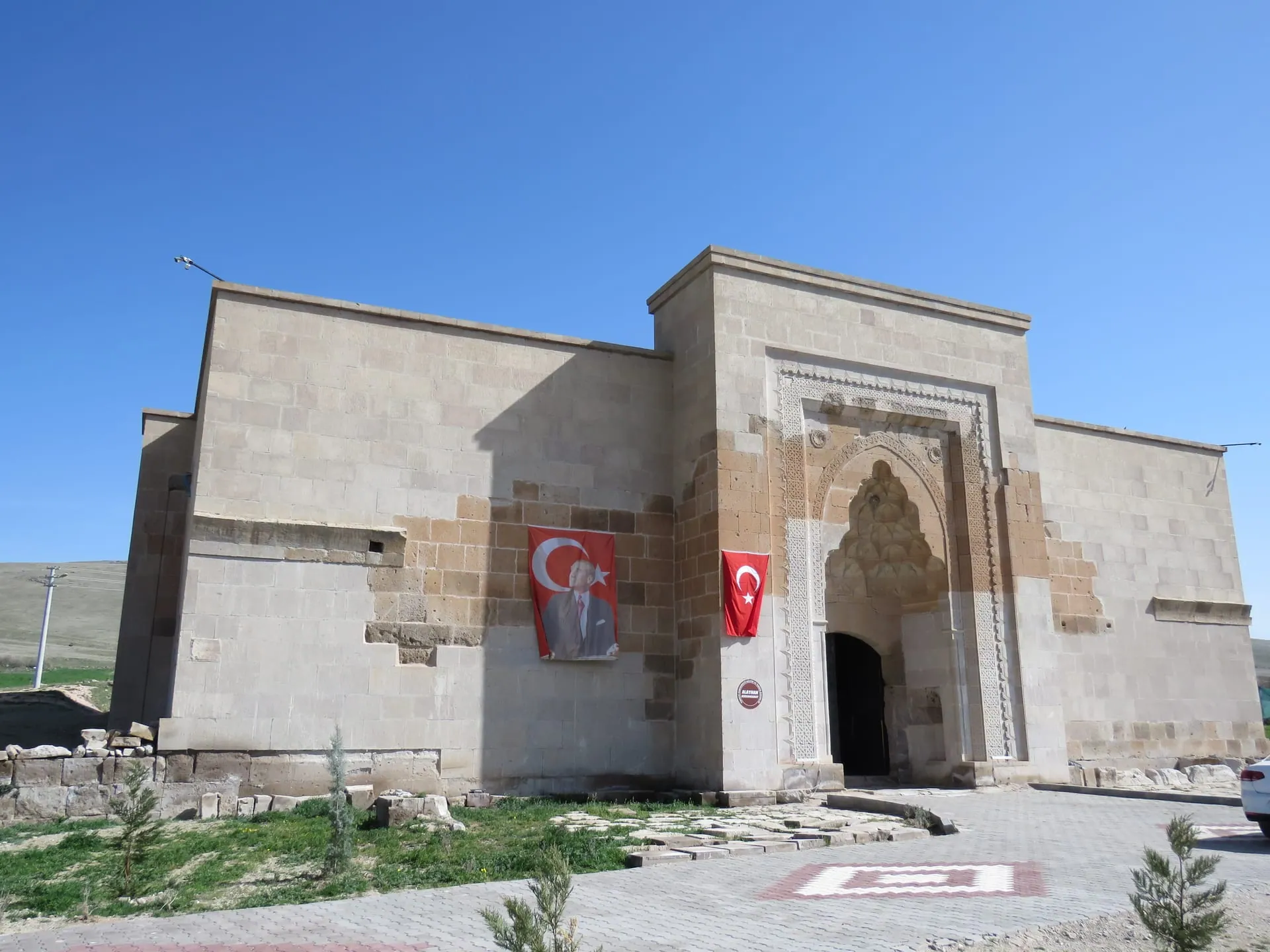 The restored covered hall of the Alay Han with its muqarnas portal